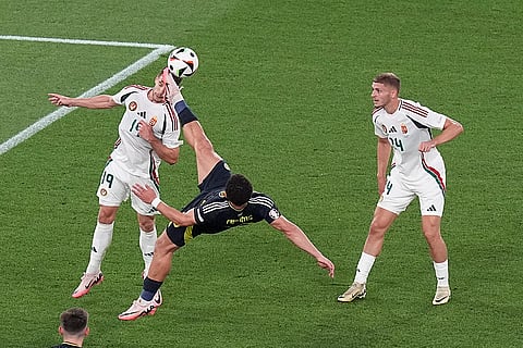 Che Adams, middle, reaches for the ball as Barnabas Varga attempts a header